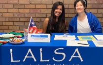 photo of students sitting at a table. 