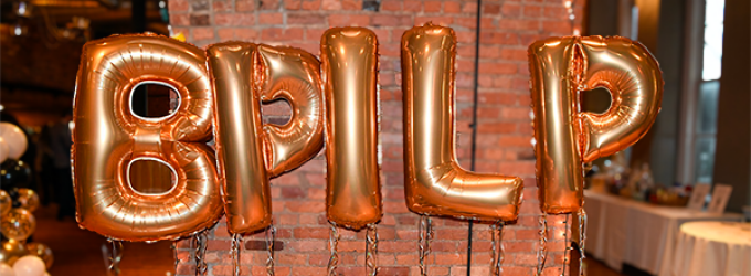 festive balloon letters that spell out BPILP. 