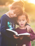 two children reading together. 