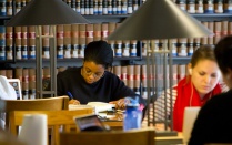 young woman doing research in a law library. 