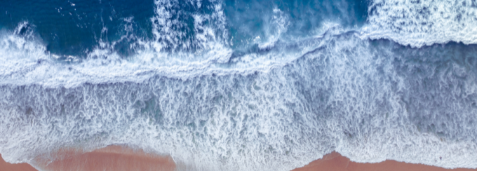 wave crashing on beach. 