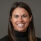 photo of smiling woman wearing black sweater.