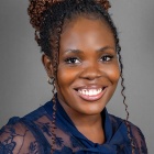 Professional portrait of Aghoghomena (Mena) H. Arhere.