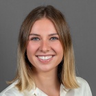 Professional portrait of Madelyn Lemay.