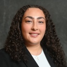 Professional portrait of Destina Tas.