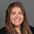 A professional portrait of Olivia Sheldon.