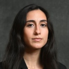 Professional portrait of Michelle Costanzo wearting black top.