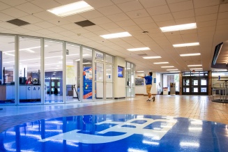 photo of student standing entering 1Capen. 