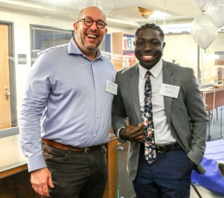 guest and student posing at the Students of Color Brunch. 